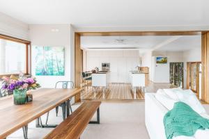 a living room with a couch and a table at Montville Resort Style Holiday Retreat with pool in Perwillowen +121 photos