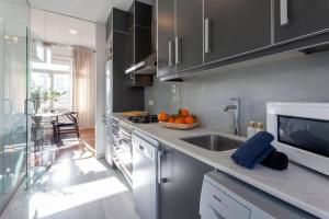 a kitchen with a sink and a counter top at San Vicente in Valencia