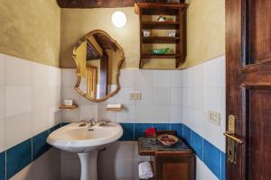 a bathroom with a sink and a mirror at Casa Teresina in Collodi +43 photos