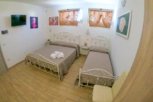 Postel nebo postele na pokoji v ubytování Anna Rita Vacanze Salento