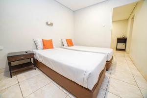 Voodi või voodid majutusasutuse Hotel Kalisma by Alia toas