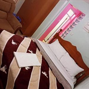 Postel nebo postele na pokoji v ubytování Cosy studio apartment bnb in thika town