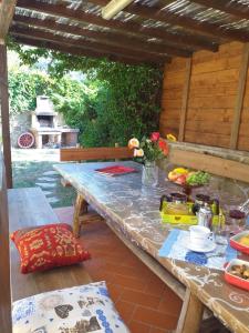 a table on a patio with at Villa Antico Borghetto Di Tigliano in Vinci