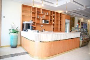 a kitchen with a counter and a counter top at Areen Hotel Al Basateen in Jeddah