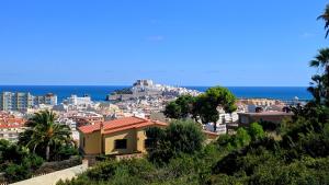 a view of a city with the ocean in the background at Blu Mare apartment in Peniscola