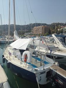 a group of boats docked in a harbor at Voilier Love Menton in Menton