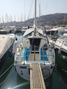 a boat docked in a marina with other boats at Voilier Love Menton in Menton
