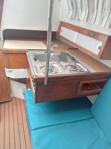 a kitchen with a stove on a boat at Voilier Love Menton in Menton