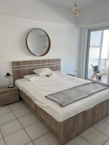 Postel nebo postele na pokoji v ubytování Cute 1bd Apartment at Vouliagmeni