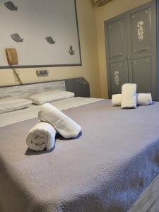 A bed or beds in a room at Panorama Hotel - Restaurant