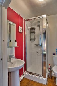 a bathroom with a shower and a sink at Finest Retreats - Clematis Cottage in Stogursey