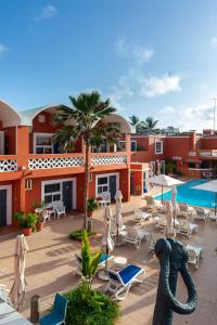 a resort with a swimming pool and a resort at La Madrague-Surf Beach Sea in Dakar