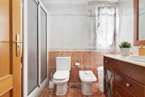 a bathroom with a toilet and a sink at Mar y Sol Salinetas in Telde +15 photos