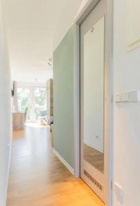 a sliding glass door in a room with a living room at B - HOME Apartments in Koblenz