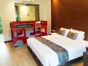 a hotel room with two beds and a lego at Southern Airport Hatyai in Hat Yai