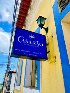 a sign for a hotel on the side of a building at Casarão Hotel Pousada in São Luís