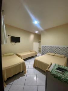 Ein Bett oder Betten in einem Zimmer der Unterkunft Casarão Hotel Pousada
