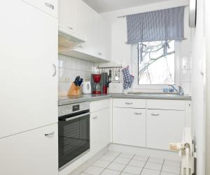 Η κουζίνα ή μικρή κουζίνα στο Residenz am Yachthafen Meeresleuchten +18 φωτογραφίες