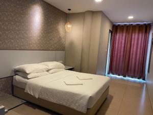 Postel nebo postele na pokoji v ubytování Hotel Jelai @ Temerloh, Pahang