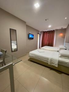 Postel nebo postele na pokoji v ubytování Hotel Jelai @ Temerloh, Pahang