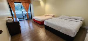 Llit o llits en una habitació de PATONG TOWER ROYAL FAMILY pta 2025