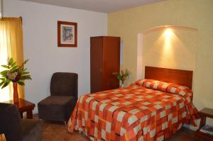 Postel nebo postele na pokoji v ubytování Hotel La Rienda Mision Tequillan