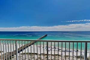 a view of the beach from a balcony at Inn at Summerwinds #1403 in Navarre