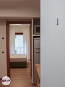 Postel nebo postele na pokoji v ubytování Bmp apartment Molveno Relax