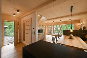 a kitchen and dining room with a table and chairs at Oma Ludwin in Sasbachwalden