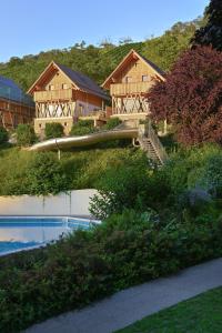 a house with a slide in front of a swimming pool at Oma Ludwin in Sasbachwalden