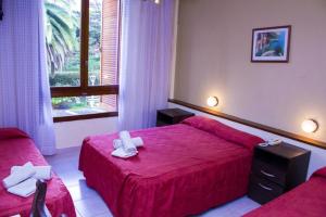Postel nebo postele na pokoji v ubytování San Remo Park Hotel + 90 fotografií