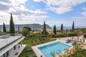 a view of a villa with a swimming pool at Sunset Lodge in Garda