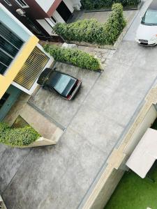 an aerial view of a car parked in a driveway at AlanVal Apartments in Accra
