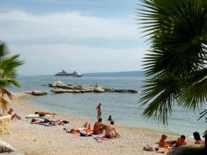 a group of people laying on a beach at Apartment Džoni in Split