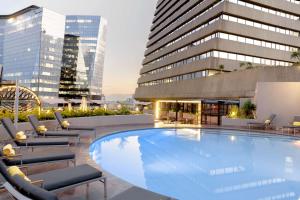a large swimming pool on top of a building at Sandton Sun and Towers in Johannesburg
