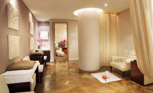 a living room with a large column in the middle of a room at Sandton Sun and Towers in Johannesburg