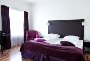 Postel nebo postele na pokoji v ubytování Quality Hotel Grand Steinkjer