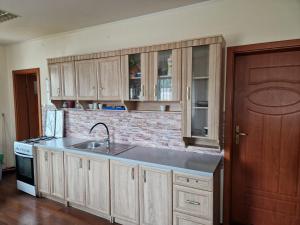 a kitchen with a sink and a counter top at NOCLEGI WOJTEK in Bytów