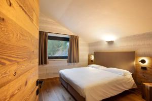 Postel nebo postele na pokoji v ubytování Valgrisa Mountain Lodges 1