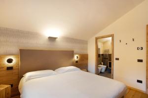 Postel nebo postele na pokoji v ubytování Valgrisa Mountain Lodges 1