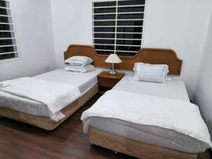 Postel nebo postele na pokoji v ubytování Teratak Qu Homestay Sijangkang