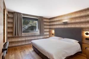 Postel nebo postele na pokoji v ubytování Valgrisa Mountain Lodges 2