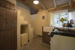a bathroom with a sink and a toilet at Pond Cottage in West Witton