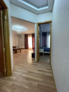 a living room with a hallway with a room with at City Center Apartment in Kutaisi