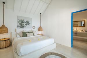 En eller flere senge i et værelse på Villa Bianca Bali