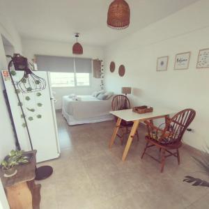 En eller flere senge i et værelse på La Félicité Alojamiento