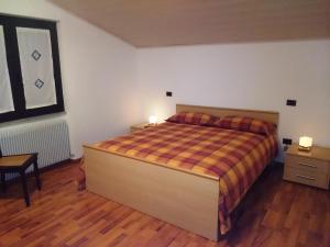 Letto o letti in una camera di Ciclaminis