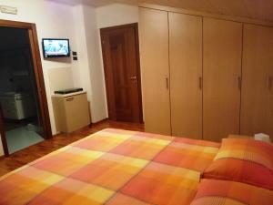 Letto o letti in una camera di Ciclaminis