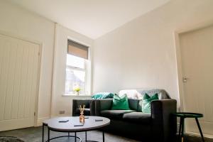 a living room with a couch and a table at Lovely 3BR Flat in the Heart of South Shields in South Shields