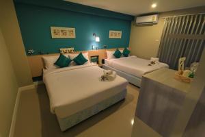 Ένα ή περισσότερα κρεβάτια σε δωμάτιο στο V-Ocean Palace